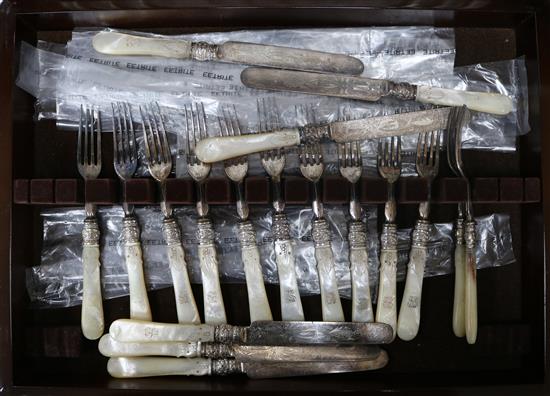 A set of 12 later Victorian plated engraved and carved mother opearl handled dessert knives and forks, later cased